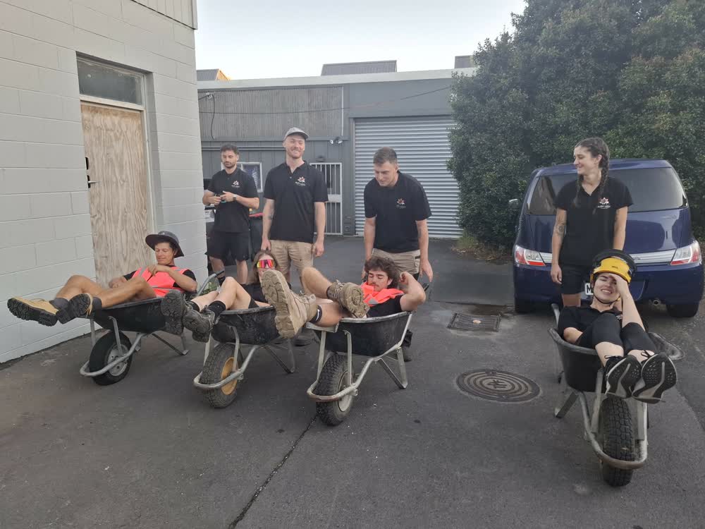 Wheelbarrow race fun outside HQ
